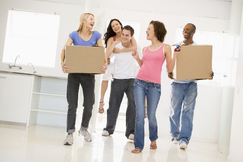 Removal van and moving team in Lambeth residential street