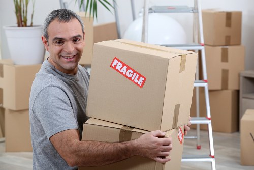 Team member safely loading boxes into a van