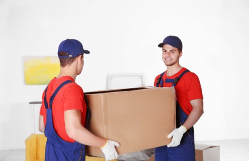 Removal team working safely inside a property