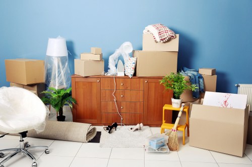 Removal team handling bulky furniture during a Lambeth move