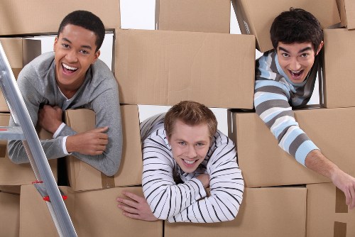 Moving boxes and furniture prepared for a home move in Lambeth