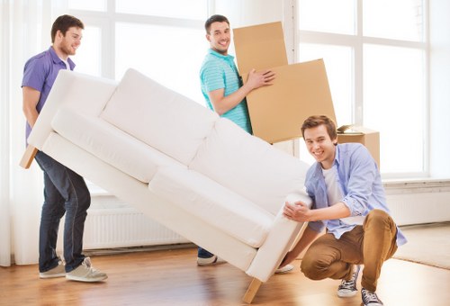 Two movers handling furniture collection in Lambeth