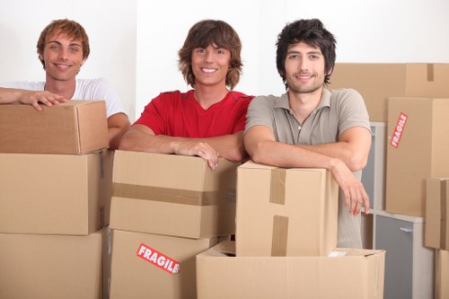 Mover wearing PPE while handling furniture safely